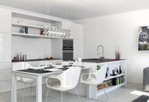 The design supplies added interest in the bright white kitchen area with open shelving to display attractive kitchen paraphernalia and cookbooks.
