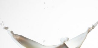 High-Res Stock Photography: Milk splashing in glass